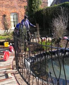 Installing the new wrought iron fence