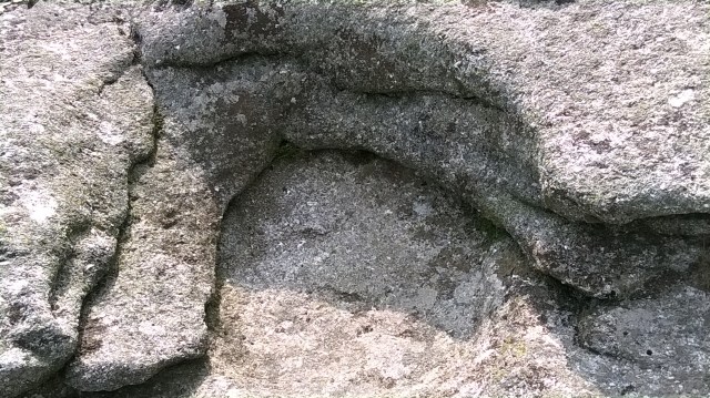 Water action has created a pool in one of the Tor's top stones