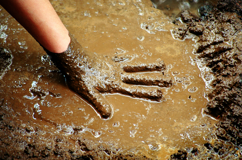 hand-in-mud
