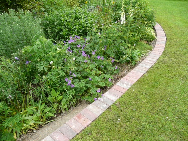 A mowing strip using block pavers