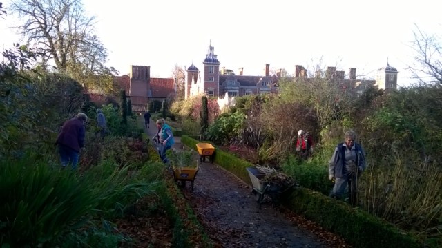 Cutting back the double borders on a beautiful autumn day