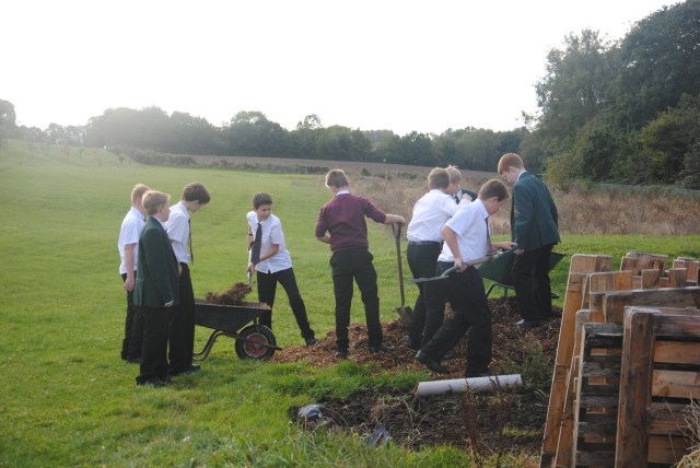 How many boys does it take to shift a pile of bark....